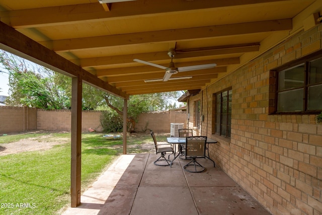 view of patio / terrace featuring outdoor dining space, a ceiling fan, and a fenced backyard