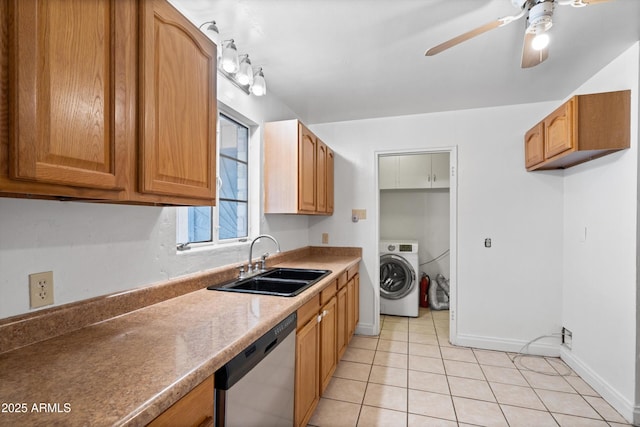 kitchen with light tile patterned floors, washer / clothes dryer, a sink, ceiling fan, and dishwasher