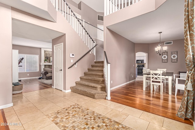 entryway featuring a chandelier and light hardwood / wood-style floors