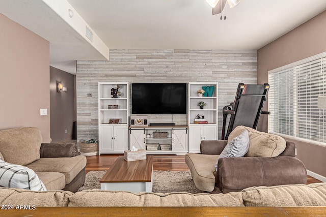 living room with ceiling fan and hardwood / wood-style flooring