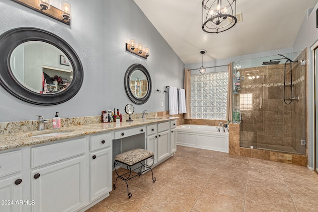 bathroom with tile patterned floors, vaulted ceiling, a chandelier, independent shower and bath, and vanity