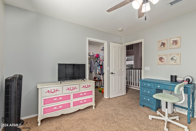 interior space featuring light colored carpet and ceiling fan