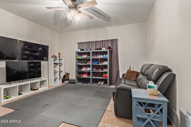 living area with ceiling fan