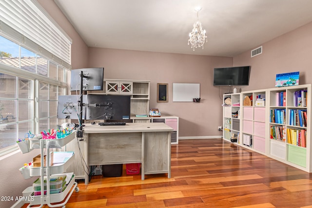 office featuring hardwood / wood-style floors and a notable chandelier