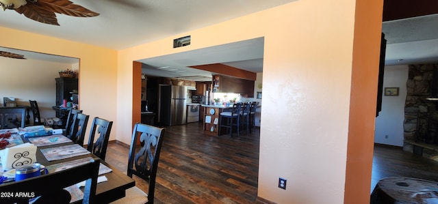 dining room with dark hardwood / wood-style flooring