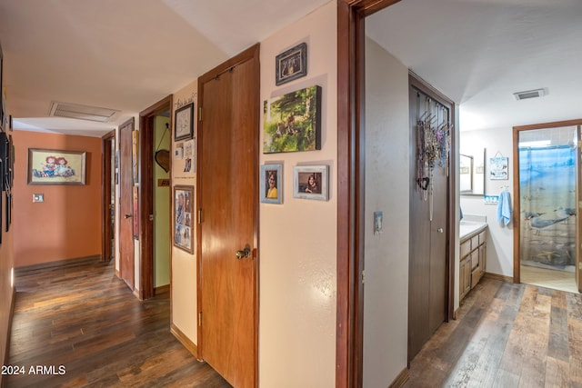 corridor with dark wood-type flooring