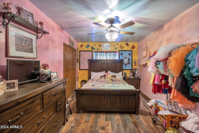 bedroom with ceiling fan and dark hardwood / wood-style flooring