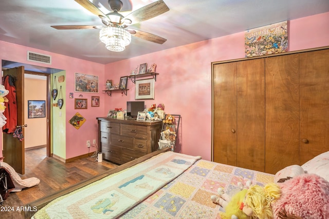 bedroom featuring hardwood / wood-style flooring, a closet, and ceiling fan