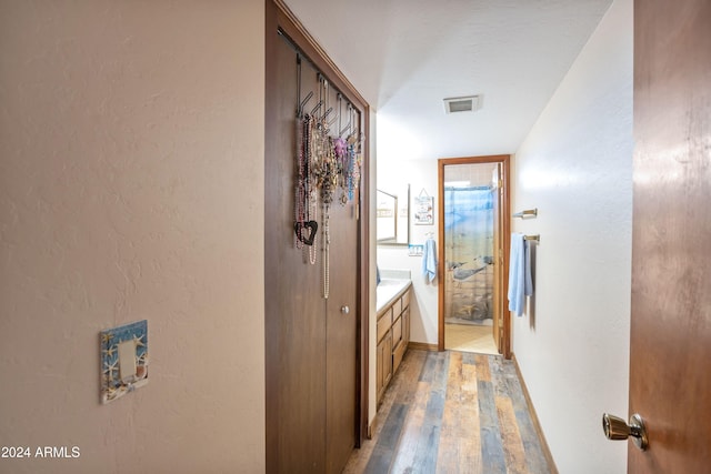 bathroom with vanity and hardwood / wood-style flooring