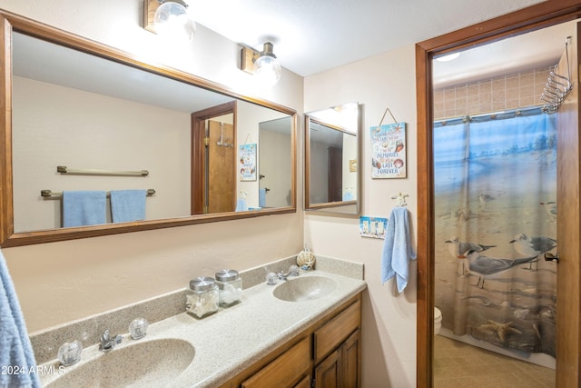 bathroom featuring vanity, toilet, and walk in shower