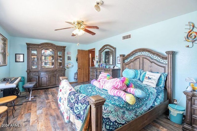 bedroom featuring ceiling fan and dark hardwood / wood-style flooring