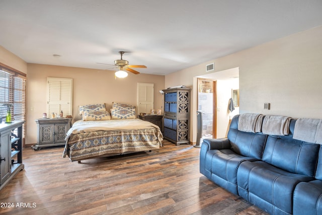 bedroom with dark wood-type flooring and ceiling fan