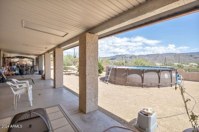 view of patio with a mountain view