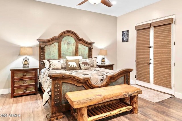 103 W Tanya Rd, Phoenix, AZ 85086 - bedroom with ceiling fan, wood finished floors, and baseboards