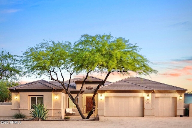 103 W Tanya Rd, Phoenix, AZ 85086 - prairie-style house with a garage, a tile roof, stucco siding, and driveway