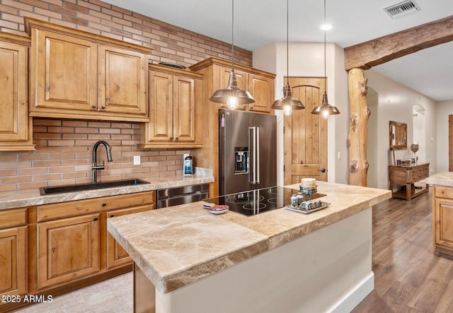 103 W Tanya Rd, Phoenix, AZ 85086 - kitchen featuring stainless steel appliances, light countertops, backsplash, a sink, and visible vents