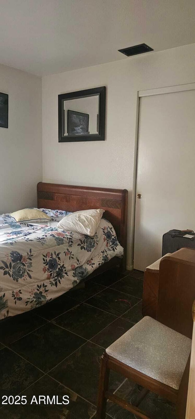 tiled bedroom with visible vents
