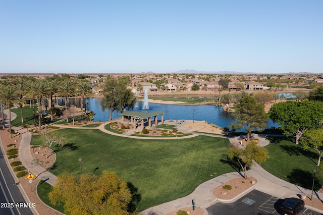 birds eye view of property featuring a water view and a residential view