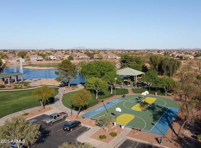 drone / aerial view with a water view and a residential view