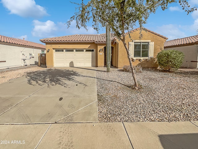 mediterranean / spanish-style house featuring a garage