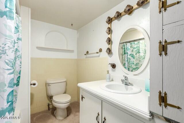 101 E Safford St, Tombstone, AZ 85638 - full bath with toilet, tile patterned floors, and vanity