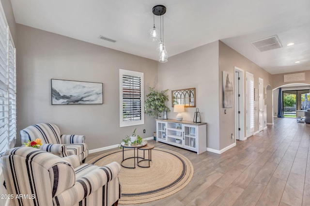 21266 S 213th Pl, Queen Creek, AZ 85142 - sitting room with arched walkways, baseboards, light wood-style floors, and recessed lighting