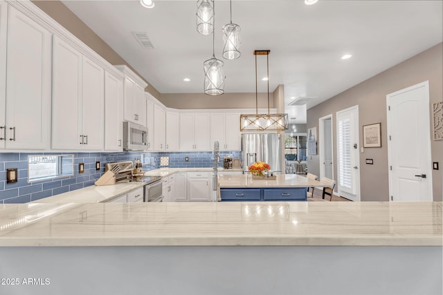 21266 S 213th Pl, Queen Creek, AZ 85142 - kitchen with appliances with stainless steel finishes, decorative backsplash, white cabinets, light stone counters, and recessed lighting