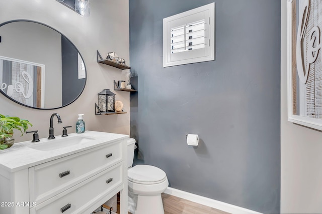 21266 S 213th Pl, Queen Creek, AZ 85142 - bathroom featuring toilet, vanity, wood finished floors, and baseboards