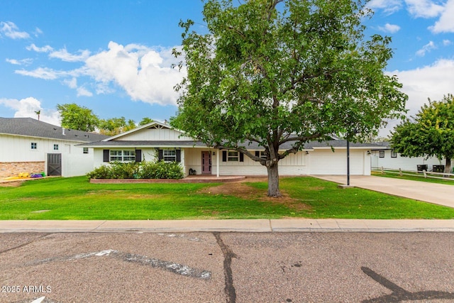 ranch-style home with a garage and a front lawn