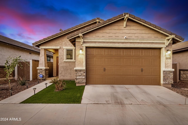 craftsman inspired home with a garage