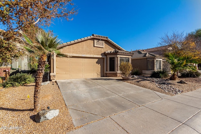 single story home featuring a garage