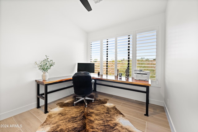 office space with vaulted ceiling and a healthy amount of sunlight