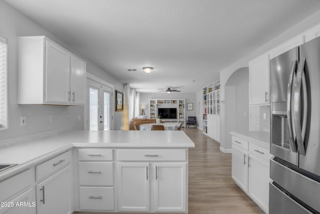 3349 E Flamingo Ct, Gilbert, AZ 85297 - kitchen with stainless steel refrigerator with ice dispenser, a peninsula, ceiling fan, and white cabinets
