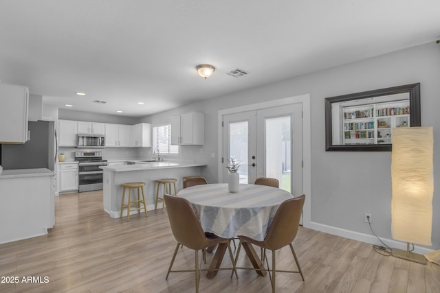 3349 E Flamingo Ct, Gilbert, AZ 85297 - dining space featuring french doors, light wood-type flooring, baseboards, and recessed lighting