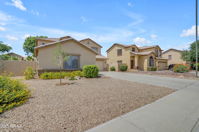 3349 E Flamingo Ct, Gilbert, AZ 85297 - mediterranean / spanish-style house with stucco siding, driveway, a tile roof, and a garage