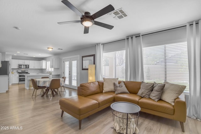 3349 E Flamingo Ct, Gilbert, AZ 85297 - living room featuring a ceiling fan, light wood-style flooring, and recessed lighting