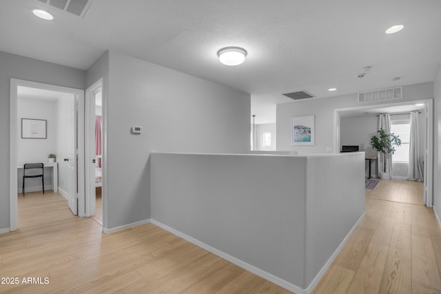 3349 E Flamingo Ct, Gilbert, AZ 85297 - hall featuring light wood-style floors, baseboards, recessed lighting, and an upstairs landing
