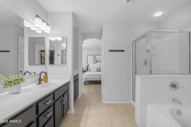 3349 E Flamingo Ct, Gilbert, AZ 85297 - full bath with double vanity, a shower stall, ensuite bath, a garden tub, and tile patterned floors