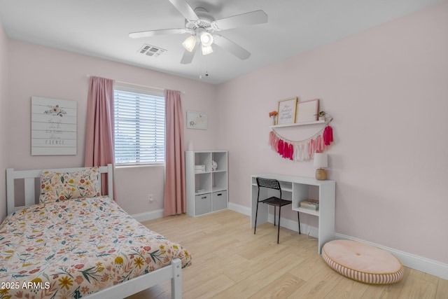 3349 E Flamingo Ct, Gilbert, AZ 85297 - bedroom with wood finished floors, baseboards, and ceiling fan