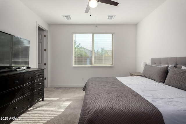 bedroom featuring light colored carpet and ceiling fan