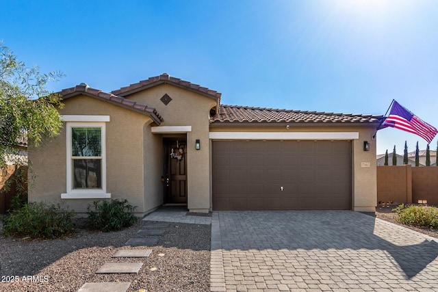 mediterranean / spanish house with a garage