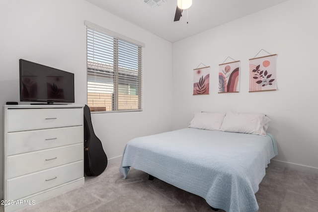 bedroom with light carpet and ceiling fan