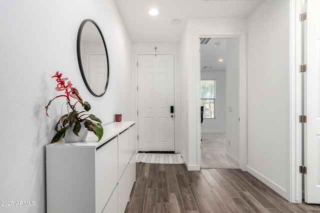 hallway featuring dark hardwood / wood-style flooring