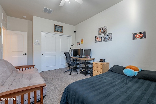 bedroom with ceiling fan, a closet, and carpet