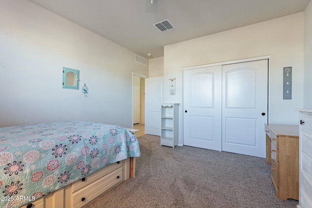 carpeted bedroom featuring a closet and ceiling fan