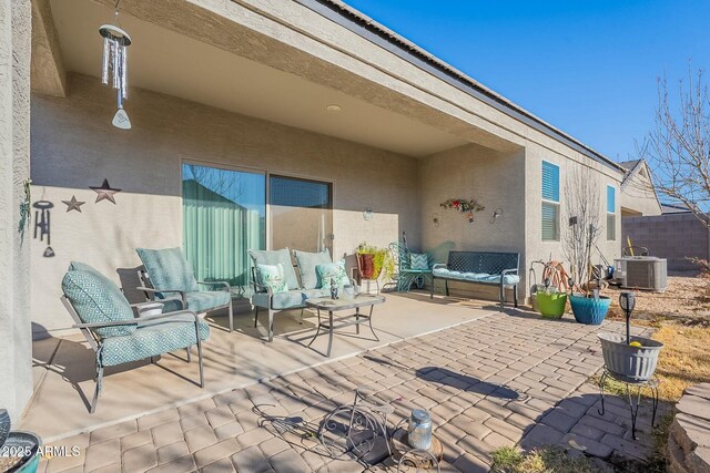 view of patio / terrace featuring outdoor lounge area and central AC