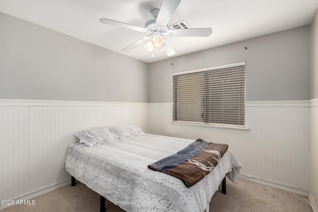 1347 E Vernoa St, San Tan Valley, AZ 85140 - carpeted bedroom with wainscoting, visible vents, and a ceiling fan