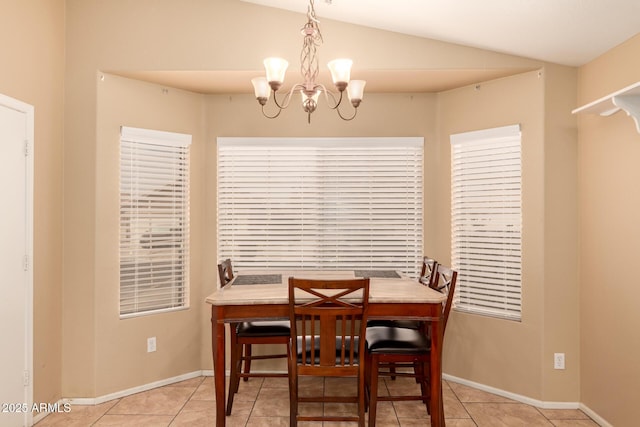 1347 E Vernoa St, San Tan Valley, AZ 85140 - dining space featuring tile patterned floors, a notable chandelier, baseboards, and lofted ceiling