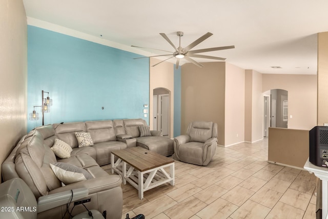 1347 E Vernoa St, San Tan Valley, AZ 85140 - living area featuring arched walkways, vaulted ceiling, and a ceiling fan