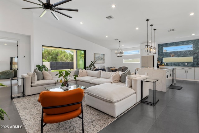 2225 E Whitton Ave E, Phoenix, AZ 85016 - living room with visible vents, high vaulted ceiling, recessed lighting, and ceiling fan with notable chandelier
